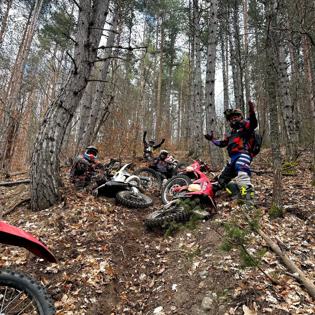 GASGAS and Husqvarna enduro bikes parked at a mountain restaurant in the Pirin range