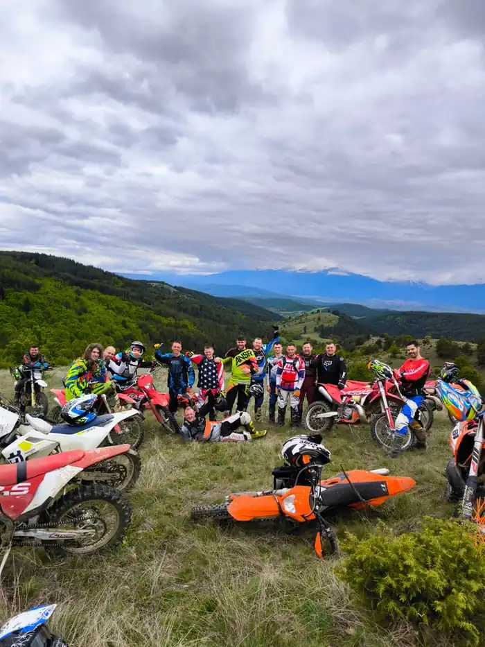 Rider tackling a river crossing on a Bulgarian enduro tour