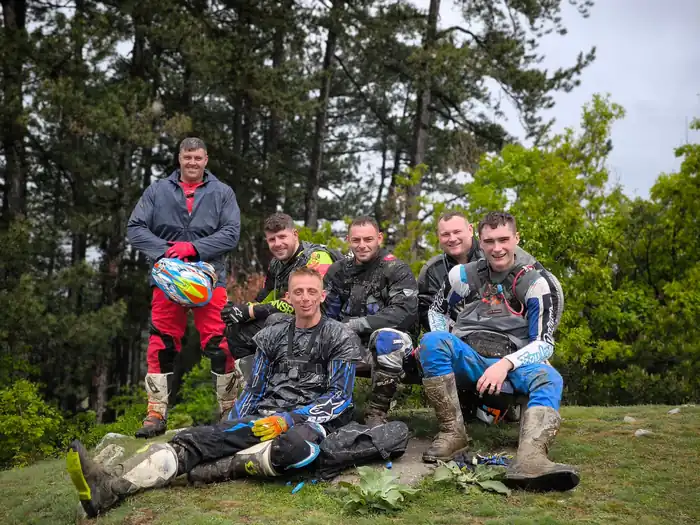 Off-road enduro riding through Bulgarian pine forest