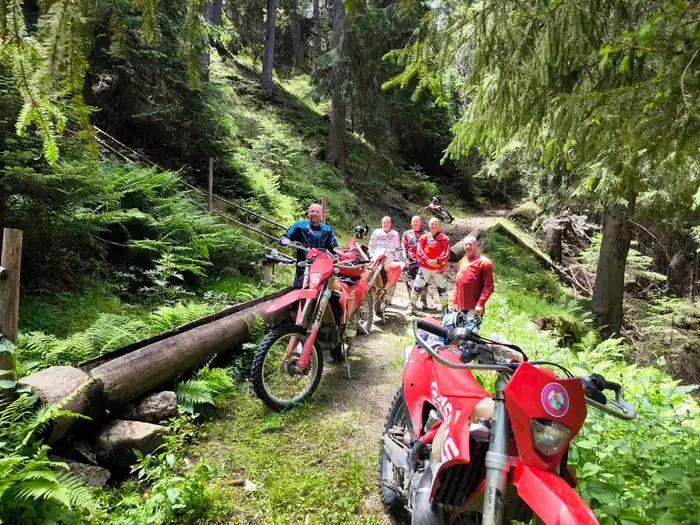 Rider tackling a river crossing on a Bulgarian enduro tour