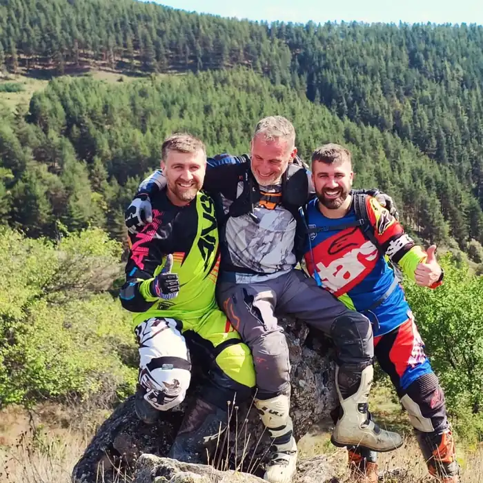 Off-road enduro riding through Bulgarian pine forest