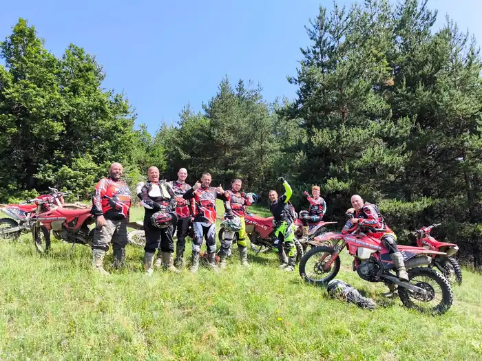 Rider tackling a river crossing on a Bulgarian enduro tour
