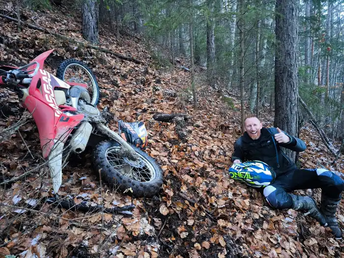 Off-road enduro riding through Bulgarian pine forest